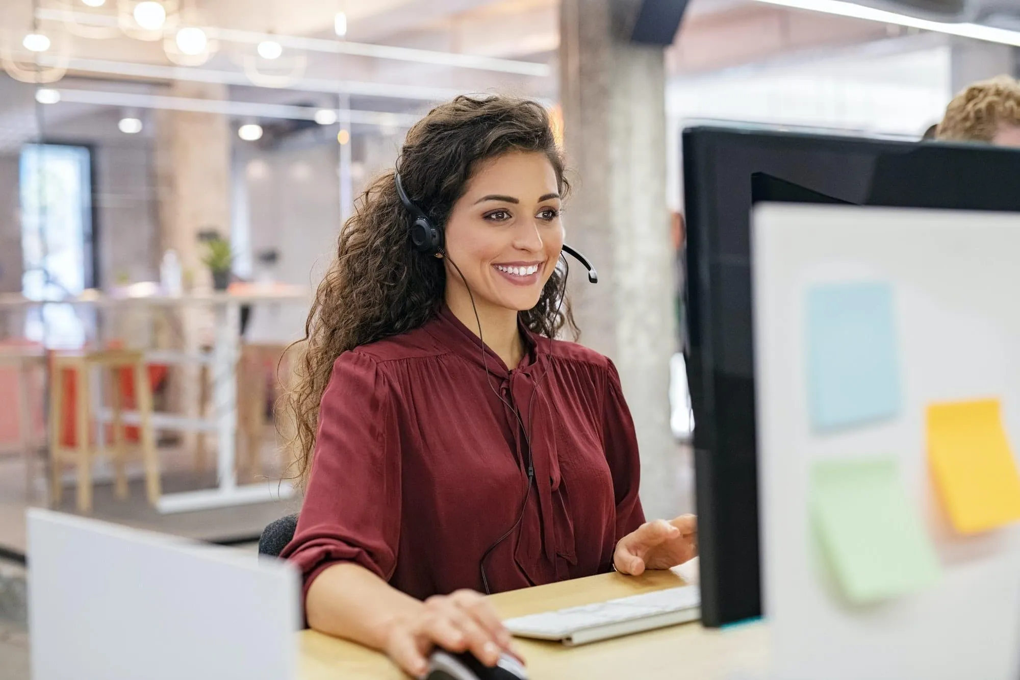 Happy smiling woman working in call center